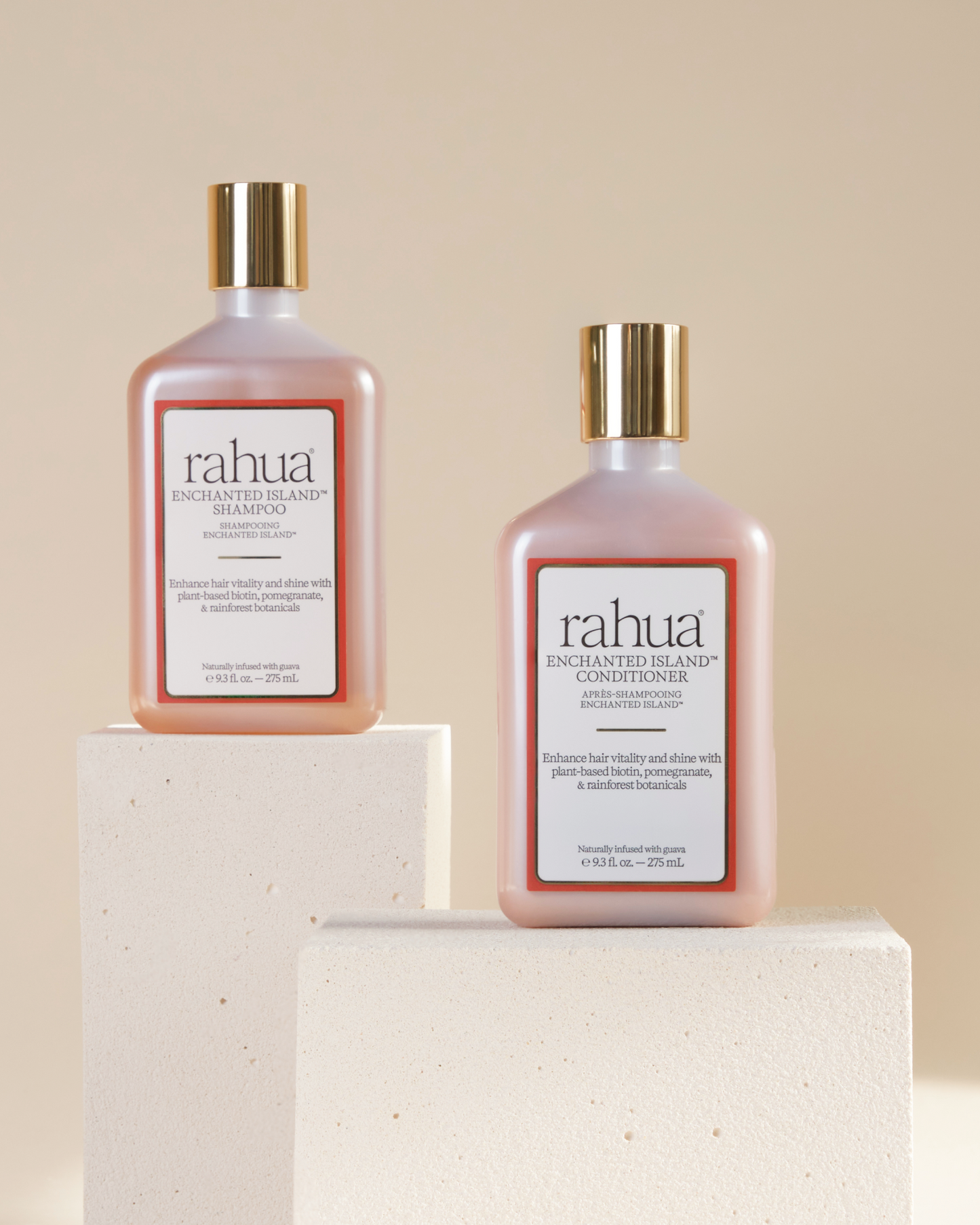 Two bottles of rahua shampoo and conditioner on a beige background|variant:93-oz