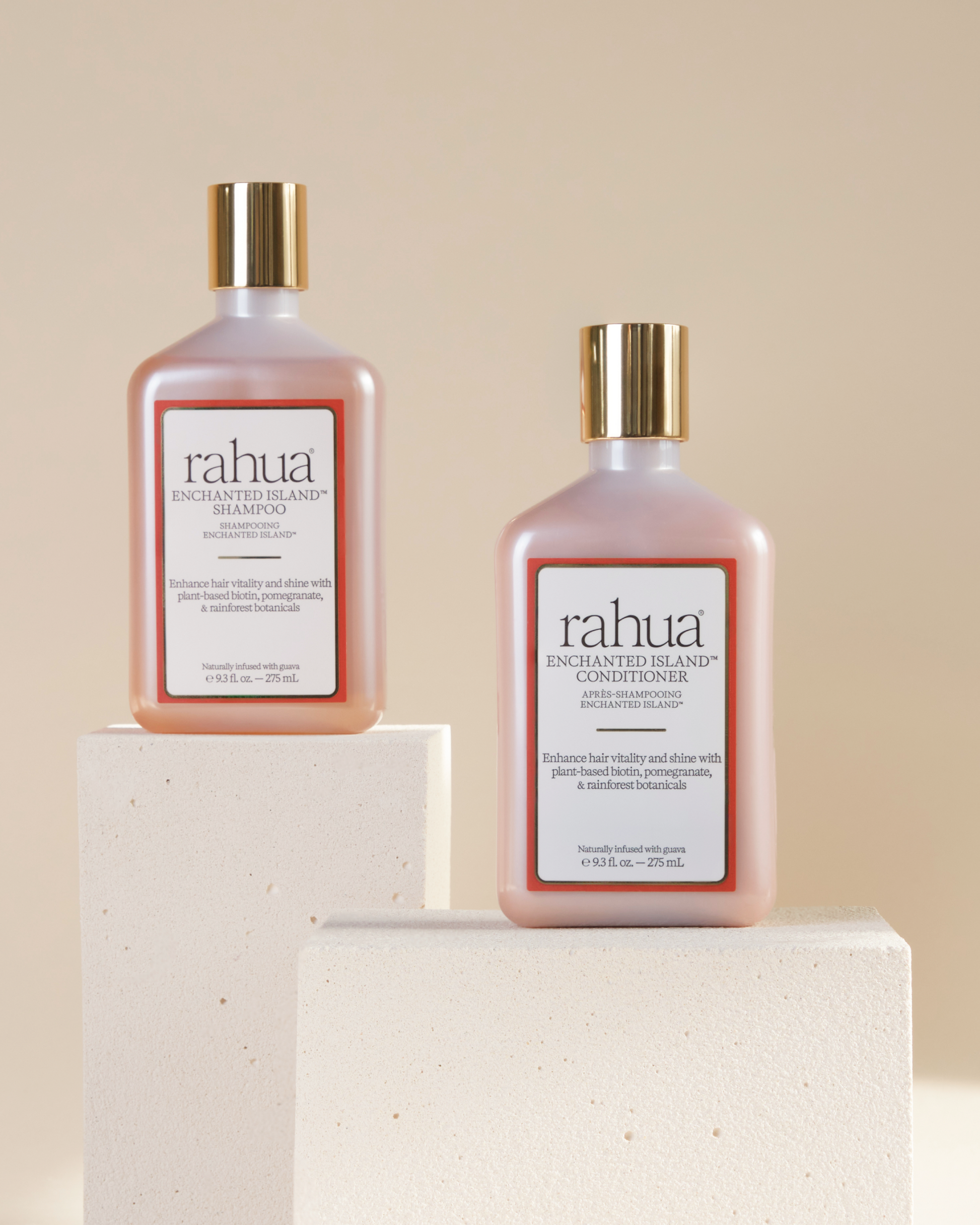 Two bottles of rahua shampoo and conditioner on a beige background|variant:93-oz